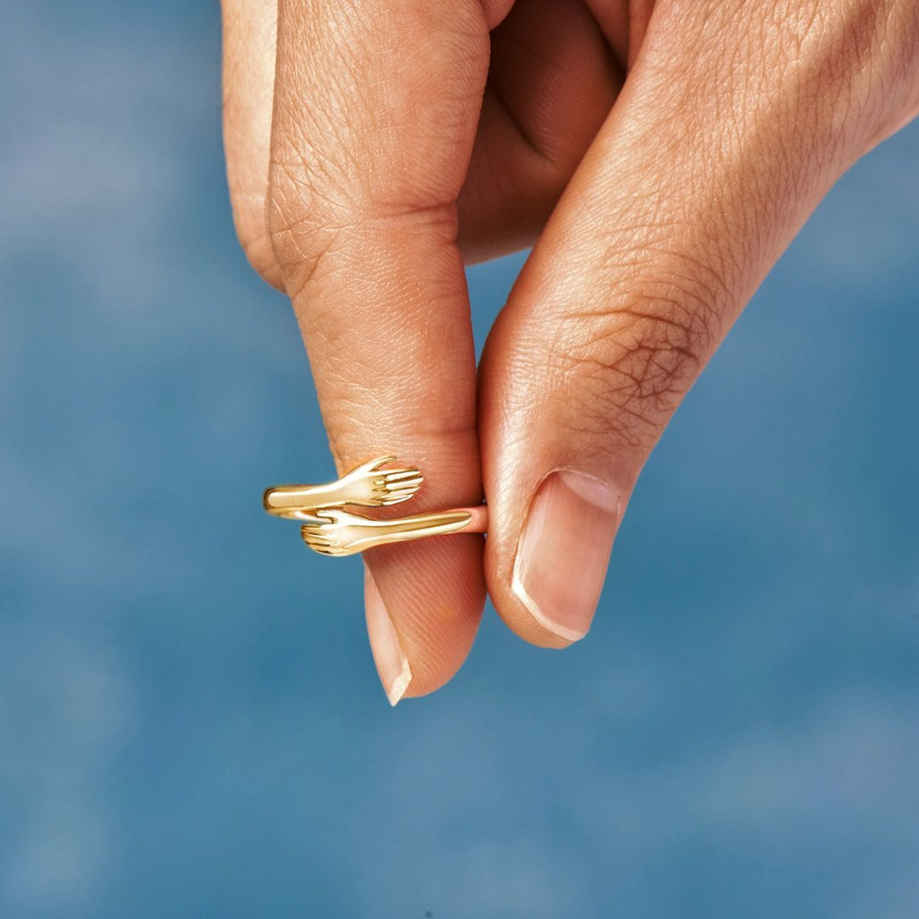 Elena – Adjustable Open Ring with Interlocking Hands Design